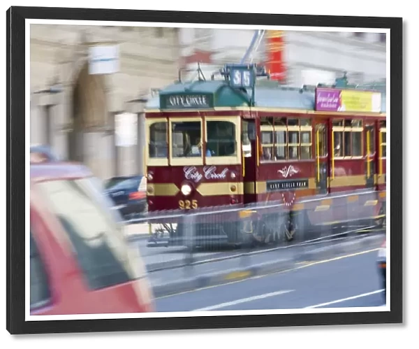 Australia, Victoria, Melbourne, streetcar (blurred motion)