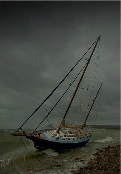 Beached yacht in storm