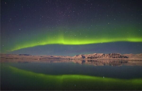 The dramatic Aurora Borealis in the night sky at Jokulsarlon, southern Iceland