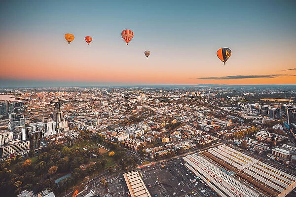 Hot air balloons over Melbourne city at dawn