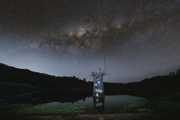 Milky Way over the intake tower in Gold Creek Reservoir in Upper Brookfield, Brisbane, Australia