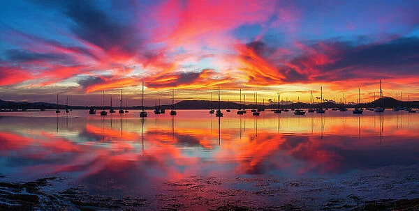 Sunrise reflections over marina