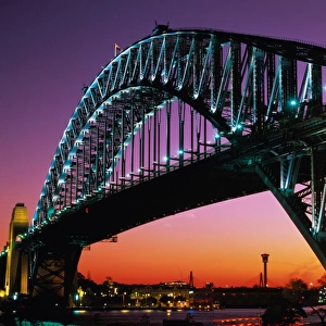Australia, New South Wales, Sydney, Harbour Bridge illuminated at dusk