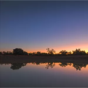 Moon rising over a lagoon at Comeroo, outback New South Wales, Australia