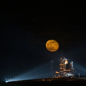 Moon rising behind the Space Shuttle Endeavour