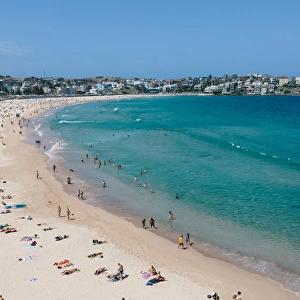 A view of Bondi beach and sunbathers on a bright sunny day
