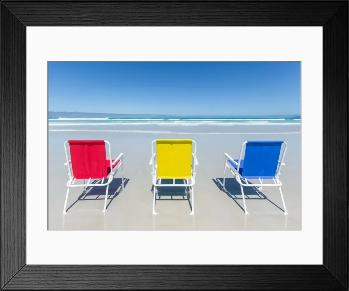 Framed Print : Beach chairs on a beach