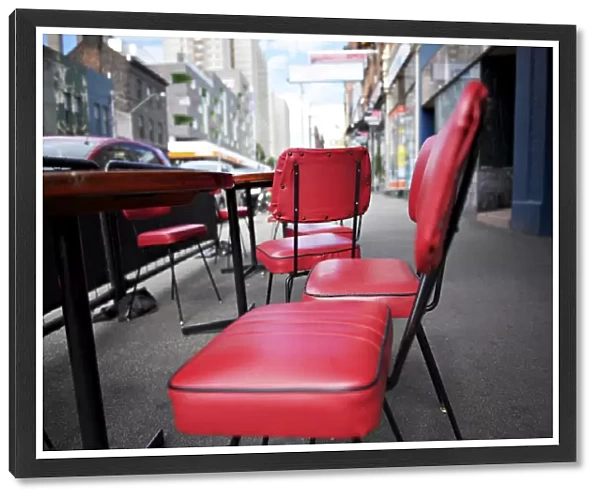 Retro red vinyl chairs on inner-city street