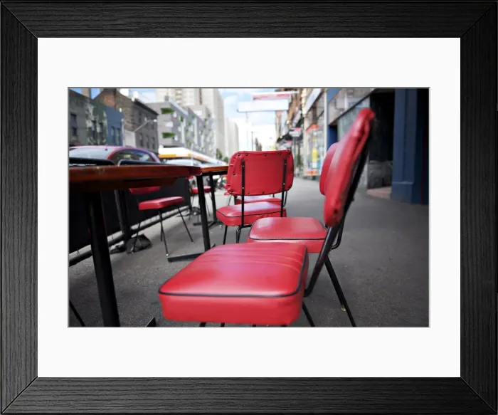 Framed Print : Retro red vinyl chairs on inner-city street Framed Print : Retro red vinyl chairs on inner-city street