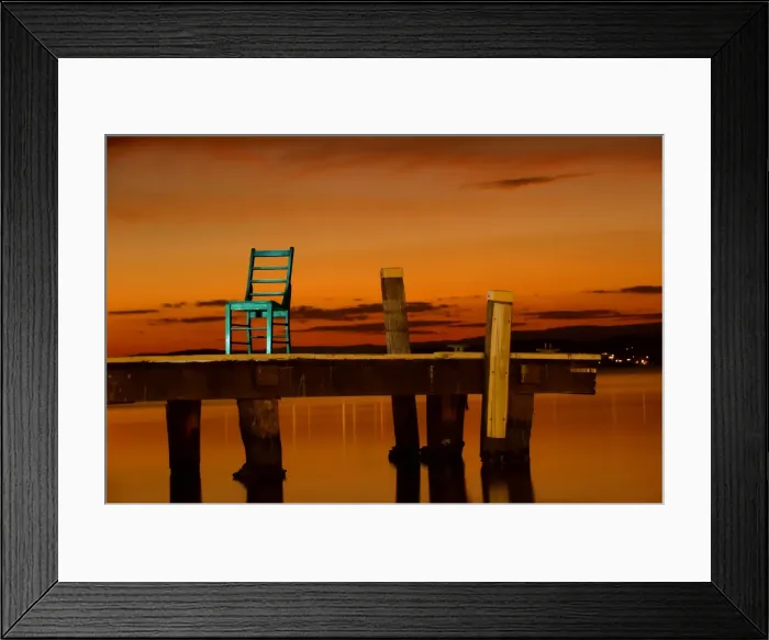 Framed Print : Green chair on wharf