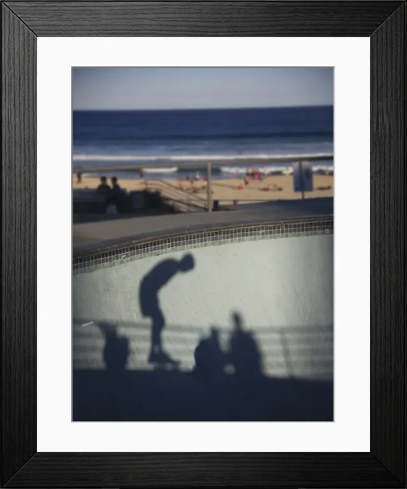 Framed Print : Shadow of skater with beach in background Framed Print : Shadow of skater with beach in background