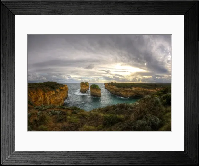 Framed Print : Great Ocean Road cliffs at cloudy sunset