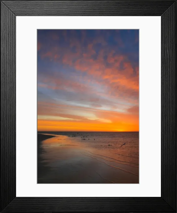 Framed Print : Image of Coral Bay at sunset with the calm waters lapping the beach Framed Print : Image of Coral Bay at sunset with the calm waters lapping the beach