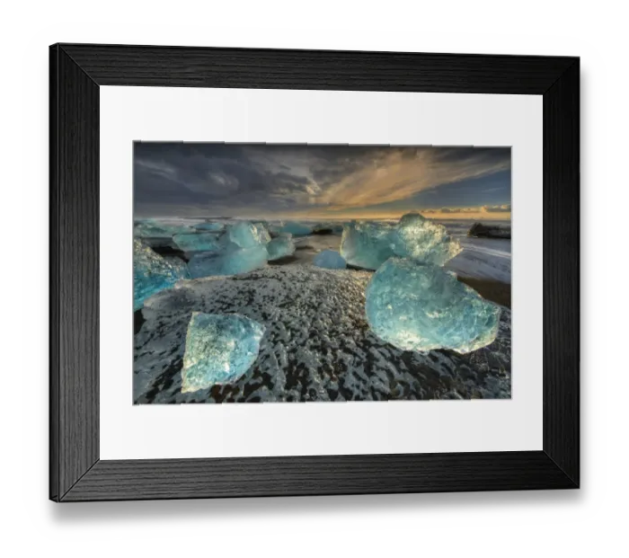 Framed Print : Jokulsarlon Beach in winter, just after a huge storm hit the coastline. Ice bergs from the nearby lagoon have been swept up onto the coastline and surge in and out with the tide Framed Print : Jokulsarlon Beach in winter, just after a huge storm hit the coastline. Ice bergs from the nearby lagoon have been swept up onto the coastline and surge in and out with the tide