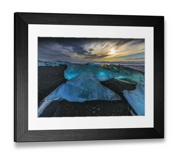 Framed Print : Jokulsarlon Beach in winter, just after a huge storm hit the coastline. Ice bergs from the nearby lagoon have been swept up onto the coastline and surge in and out with the tide Framed Print : Jokulsarlon Beach in winter, just after a huge storm hit the coastline. Ice bergs from the nearby lagoon have been swept up onto the coastline and surge in and out with the tide