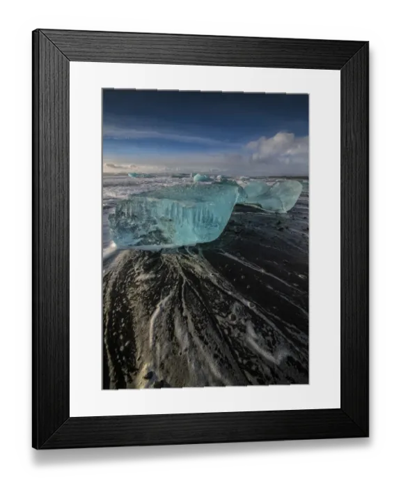 Framed Print : Jokulsarlon Beach in winter, just after a huge storm hit the coastline. Ice bergs from the nearby lagoon have been swept up onto the coastline and surge in and out with the tide Framed Print : Jokulsarlon Beach in winter, just after a huge storm hit the coastline. Ice bergs from the nearby lagoon have been swept up onto the coastline and surge in and out with the tide