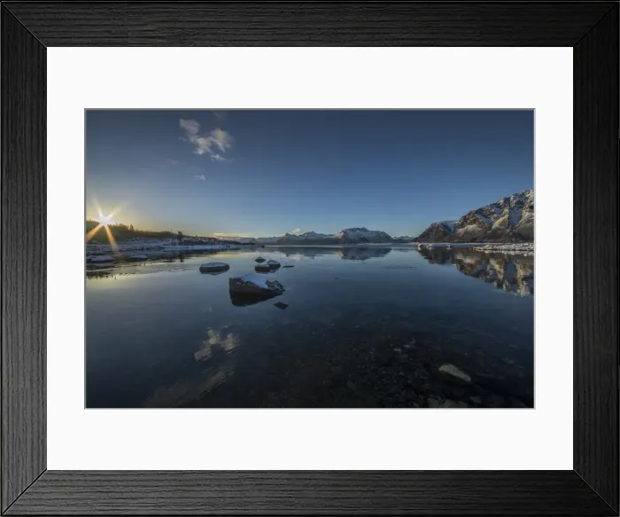 Framed Print : A winter sunstar peeps over the mountain range at dawn, Lofoten Peninsular, Norway Framed Print : A winter sunstar peeps over the mountain range at dawn, Lofoten Peninsular, Norway