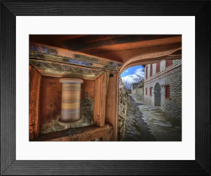 Framed Print : A spinning Prayer wheel used in worship, in the high mountain village of Tukuch, Mustang, Western Himalayas, Nepal