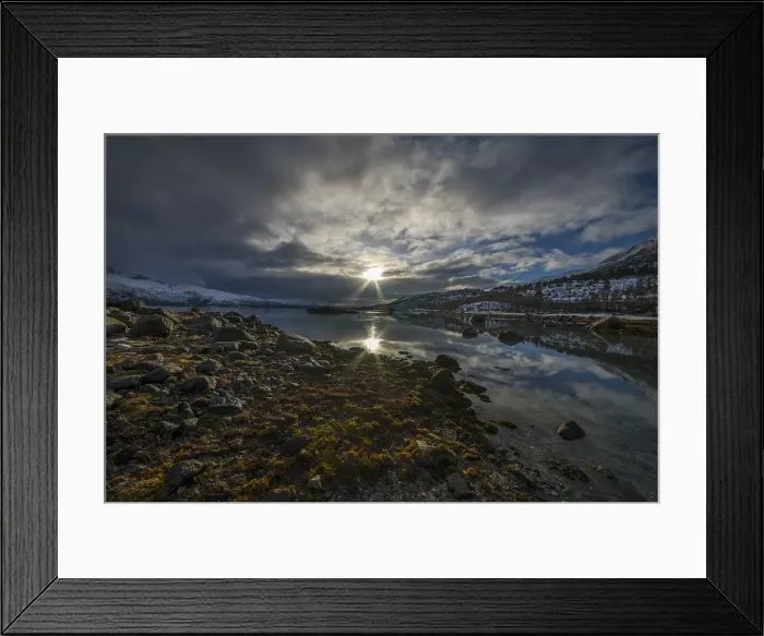 Framed Print : Sunstar on the coastline near Austvagoya