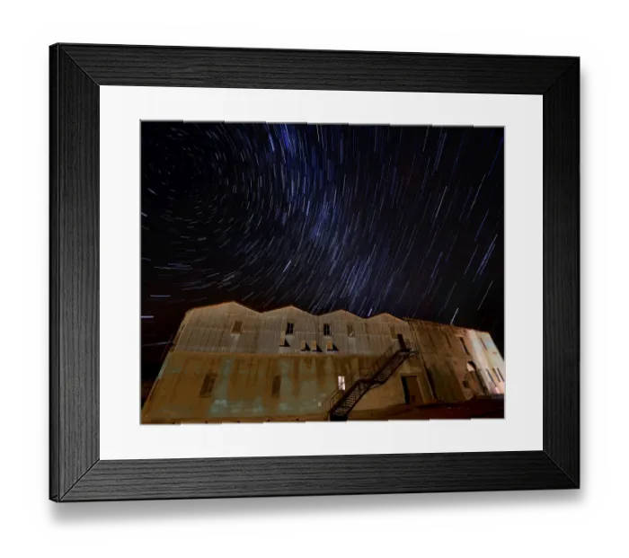 Framed Print : Star-trails appearing over an old warehouse, Oamaru, South Island, New Zealand