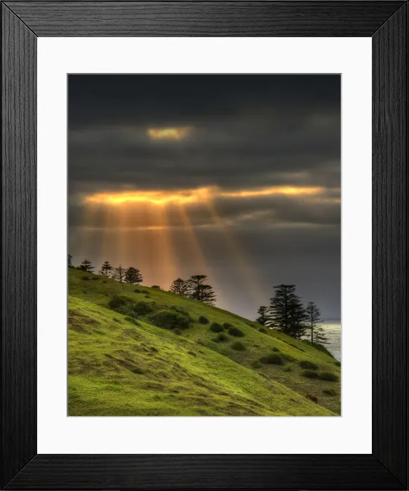 Framed Print : Crepuscular rays over Cemetery bay