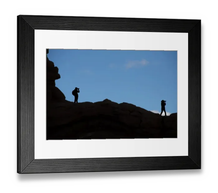 Framed Print : Photographers silhouretted against the sky in the Arches national park, Utah, USA