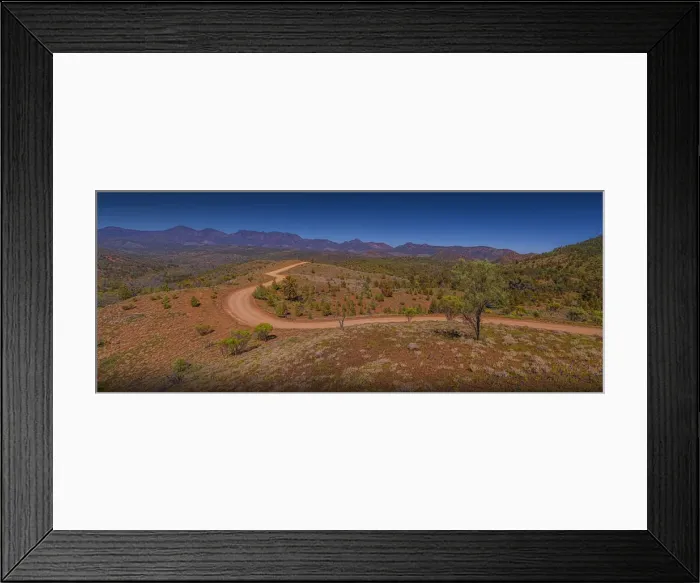 Framed Print : The gravel road winds through the Bunyeroo Valey in the Flinders Ranges national park, South Australia