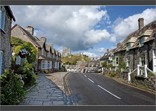 A view down the high Street of Corfe Castle, Isle of Purbeck, Dorset, England
