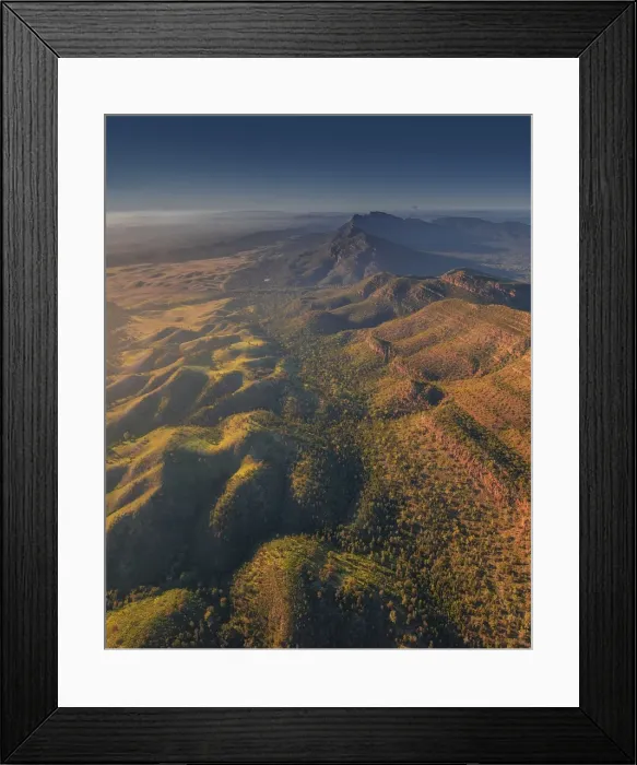 Framed Print : An aerial view of the rugged and scenically beautiful mountain ranges of Wilpena Pound in the southern region of the Flinders Ranges National Park in South Australia
