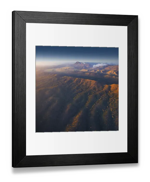 Framed Print : An aerial view of the rugged and scenically beautiful mountain ranges of Wilpena Pound in the southern region of the Flinders Ranges National Park in South Australia Framed Print : An aerial view of the rugged and scenically beautiful mountain ranges of Wilpena Pound in the southern region of the Flinders Ranges National Park in South Australia