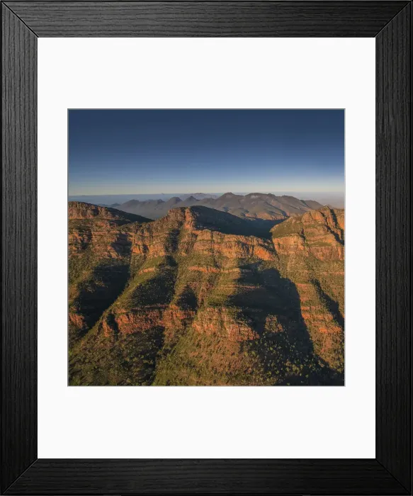 Framed Print : An aerial view of the rugged and scenically beautiful mountain ranges of Wilpena Pound in the southern region of the Flinders Ranges National Park in South Australia