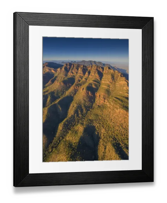 Framed Print : An aerial view of the rugged and scenically beautiful mountain ranges of Wilpena Pound in the southern region of the Flinders Ranges National Park in South Australia Framed Print : An aerial view of the rugged and scenically beautiful mountain ranges of Wilpena Pound in the southern region of the Flinders Ranges National Park in South Australia