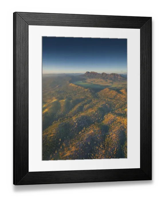 Framed Print : An aerial view of the rugged and scenically beautiful mountain ranges of Wilpena Pound in the southern region of the Flinders Ranges National Park in South Australia