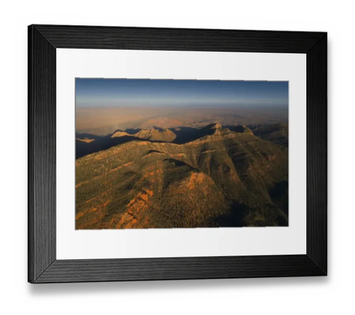 Framed Print : An aerial view of the rugged and scenically beautiful mountain ranges of Wilpena Pound in the southern region of the Flinders Ranges National Park in South Australia
