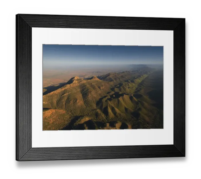 Framed Print : An aerial view of the rugged and scenically beautiful mountain ranges of Wilpena Pound in the southern region of the Flinders Ranges National Park in South Australia