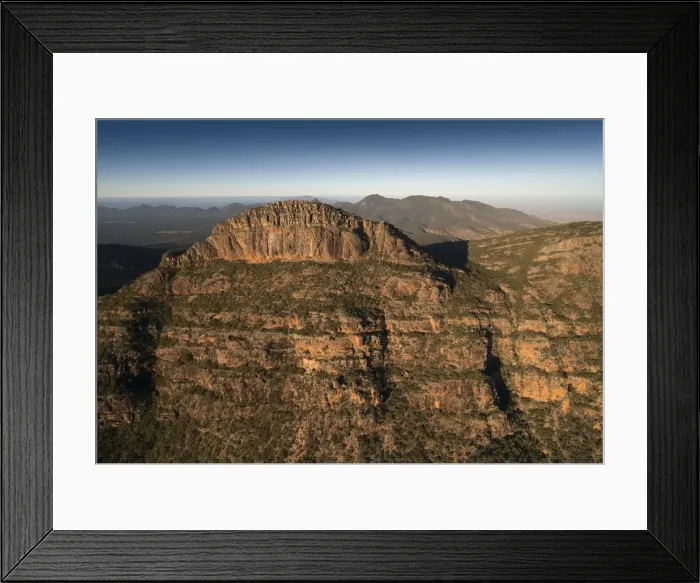 Framed Print : An aerial view of the rugged and scenically beautiful mountain ranges of Wilpena Pound in the southern region of the Flinders Ranges National Park in South Australia Framed Print : An aerial view of the rugged and scenically beautiful mountain ranges of Wilpena Pound in the southern region of the Flinders Ranges National Park in South Australia
