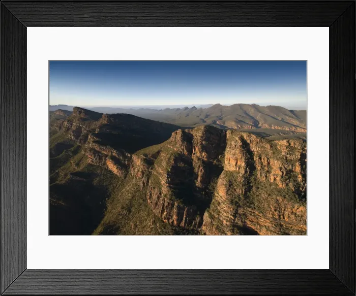 Framed Print : An aerial view of the rugged and scenically beautiful mountain ranges of Wilpena Pound in the southern region of the Flinders Ranges National Park in South Australia