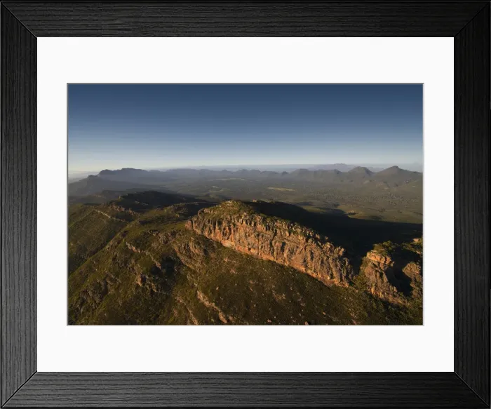 Framed Print : An aerial view of the rugged and scenically beautiful mountain ranges of Wilpena Pound in the southern region of the Flinders Ranges National Park in South Australia Framed Print : An aerial view of the rugged and scenically beautiful mountain ranges of Wilpena Pound in the southern region of the Flinders Ranges National Park in South Australia