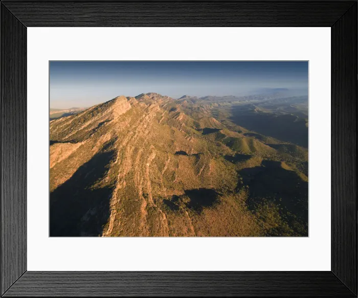 Framed Print : An aerial view of the rugged and scenically beautiful mountain ranges of Wilpena Pound in the southern region of the Flinders Ranges National Park in South Australia Framed Print : An aerial view of the rugged and scenically beautiful mountain ranges of Wilpena Pound in the southern region of the Flinders Ranges National Park in South Australia