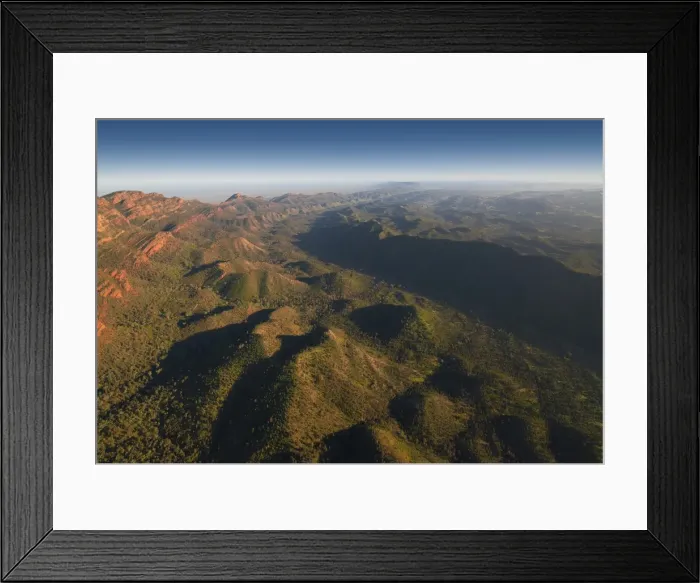 Framed Print : An aerial view of the rugged and scenically beautiful mountain ranges of Wilpena Pound in the southern region of the Flinders Ranges National Park in South Australia Framed Print : An aerial view of the rugged and scenically beautiful mountain ranges of Wilpena Pound in the southern region of the Flinders Ranges National Park in South Australia