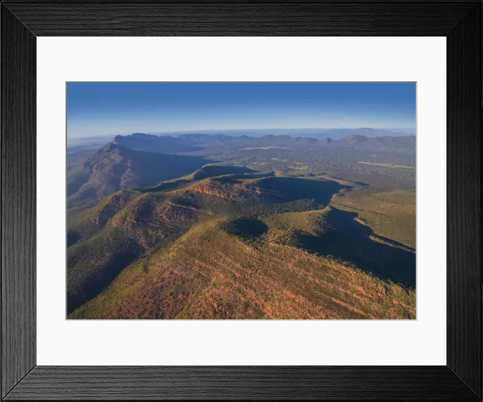 Framed Print : An aerial view of the rugged and scenically beautiful mountain ranges of Wilpena Pound in the southern region of the Flinders Ranges National Park in South Australia Framed Print : An aerial view of the rugged and scenically beautiful mountain ranges of Wilpena Pound in the southern region of the Flinders Ranges National Park in South Australia
