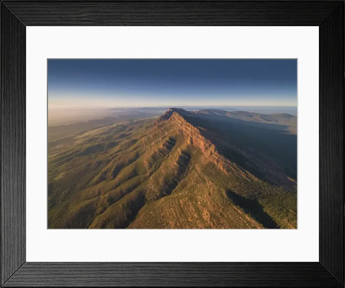 Framed Print : An aerial view of the rugged and scenically beautiful mountain ranges of Wilpena Pound in the southern region of the Flinders Ranges National Park in South Australia Framed Print : An aerial view of the rugged and scenically beautiful mountain ranges of Wilpena Pound in the southern region of the Flinders Ranges National Park in South Australia
