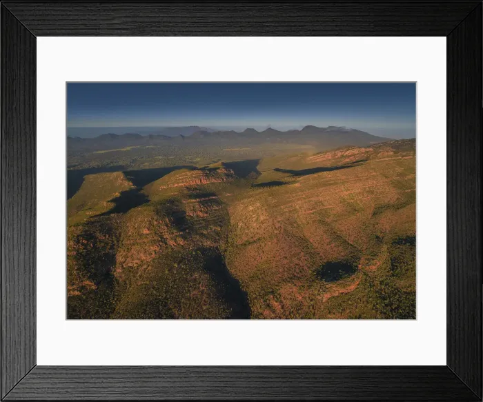 Framed Print : An aerial view of the rugged and scenically beautiful mountain ranges of Wilpena Pound in the southern region of the Flinders Ranges National Park in South Australia Framed Print : An aerial view of the rugged and scenically beautiful mountain ranges of Wilpena Pound in the southern region of the Flinders Ranges National Park in South Australia