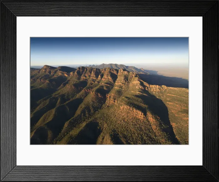 Framed Print : An aerial view of the rugged and scenically beautiful mountain ranges of Wilpena Pound in the southern region of the Flinders Ranges National Park in South Australia Framed Print : An aerial view of the rugged and scenically beautiful mountain ranges of Wilpena Pound in the southern region of the Flinders Ranges National Park in South Australia