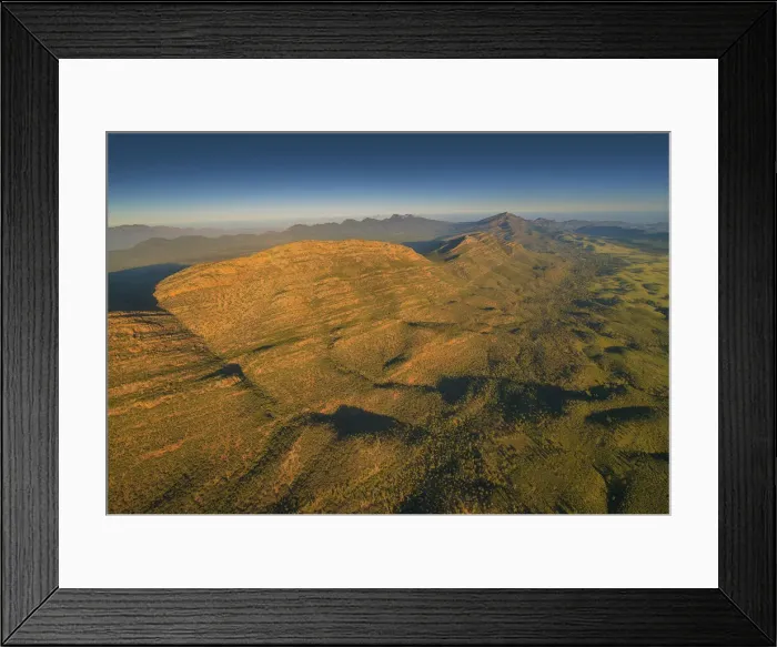 Framed Print : An aerial view of the rugged and scenically beautiful mountain ranges of Wilpena Pound in the southern region of the Flinders Ranges National Park in South Australia Framed Print : An aerial view of the rugged and scenically beautiful mountain ranges of Wilpena Pound in the southern region of the Flinders Ranges National Park in South Australia