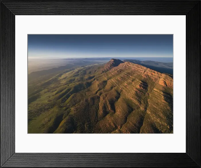Framed Print : An aerial view of the rugged and scenically beautiful mountain ranges of Wilpena Pound in the southern region of the Flinders Ranges National Park in South Australia