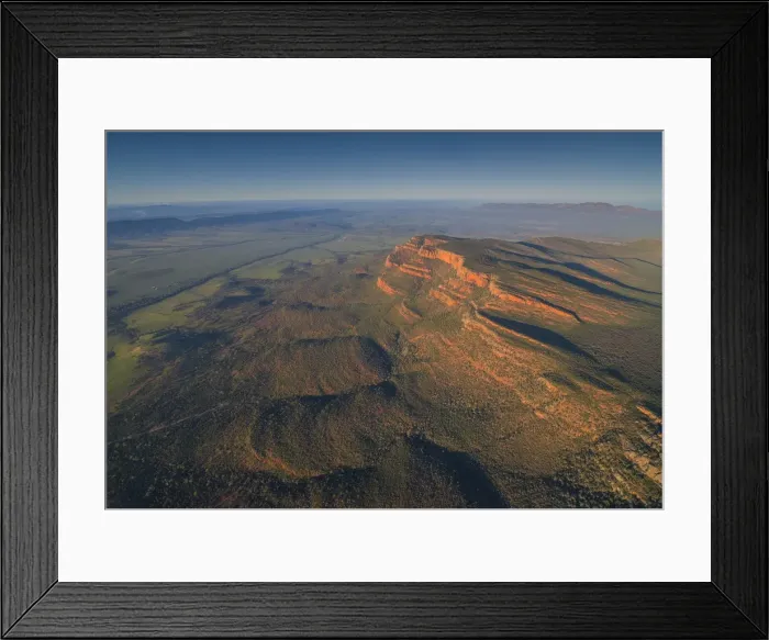 Framed Print : An aerial view of the rugged and scenically beautiful mountain ranges of Wilpena Pound in the southern region of the Flinders Ranges National Park in South Australia Framed Print : An aerial view of the rugged and scenically beautiful mountain ranges of Wilpena Pound in the southern region of the Flinders Ranges National Park in South Australia