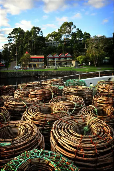 Lobster pots stacked on the Strahan wharf, west coastline of Tasmania