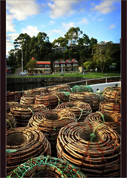 Lobster pots stacked on the Strahan wharf, west coastline of Tasmania