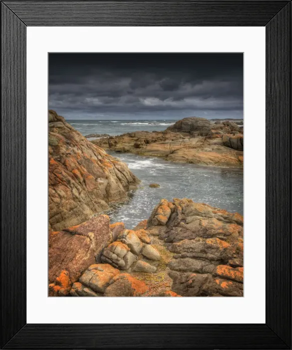 Framed Print : Half moon bay on the West coastline of King Island, has large rock-pools and magnificent red coloured lichen boulders of pink granite. Bass Strait, Tasmania Framed Print : Half moon bay on the West coastline of King Island, has large rock-pools and magnificent red coloured lichen boulders of pink granite. Bass Strait, Tasmania